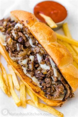 ¡El famoso Philly Cheesesteak, un irresistible manjar de carne jugosa y queso derretido!